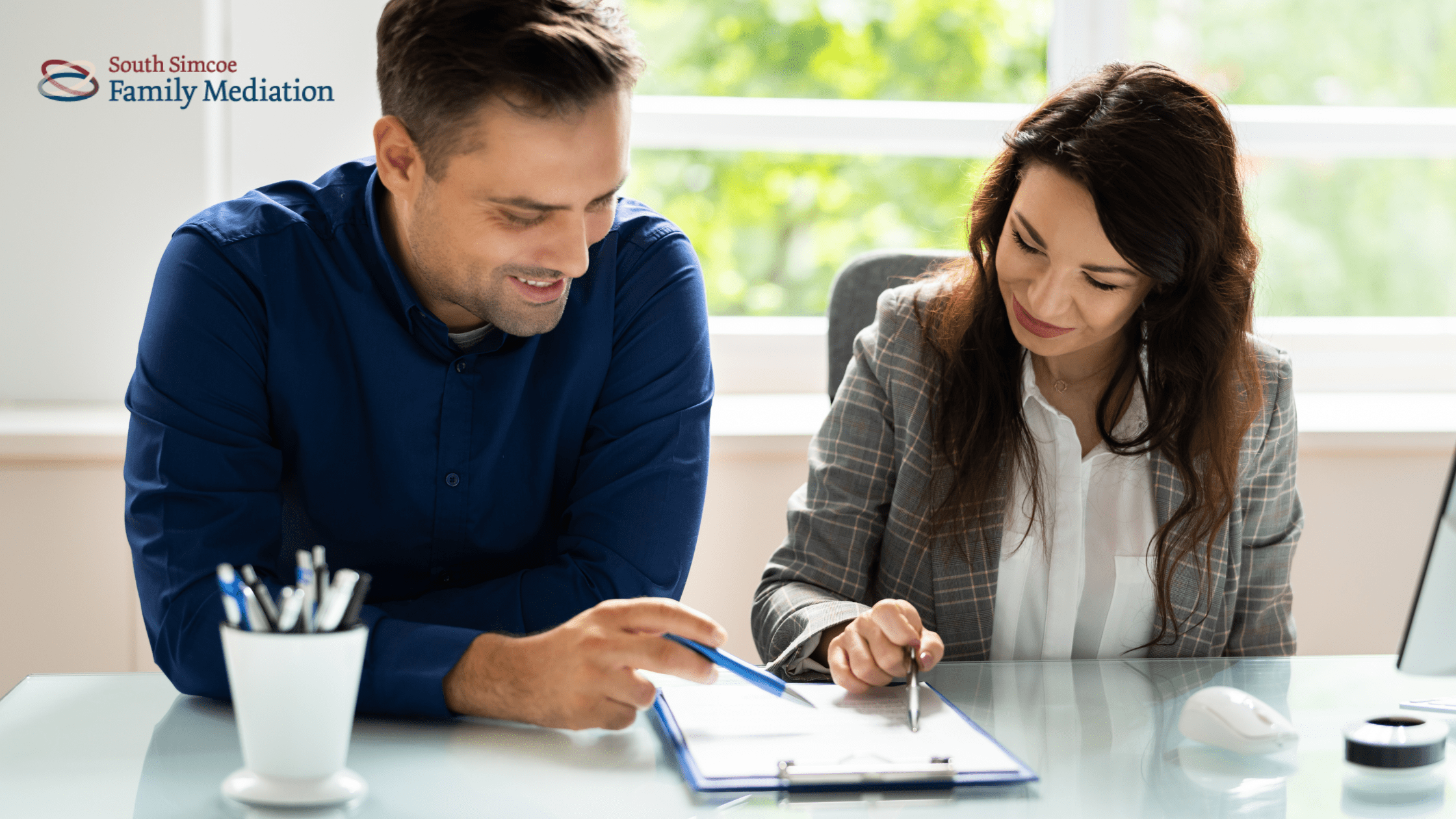 Divorce Mediation Session in Ontario Divorcing couple discussing separation agreement through mediation